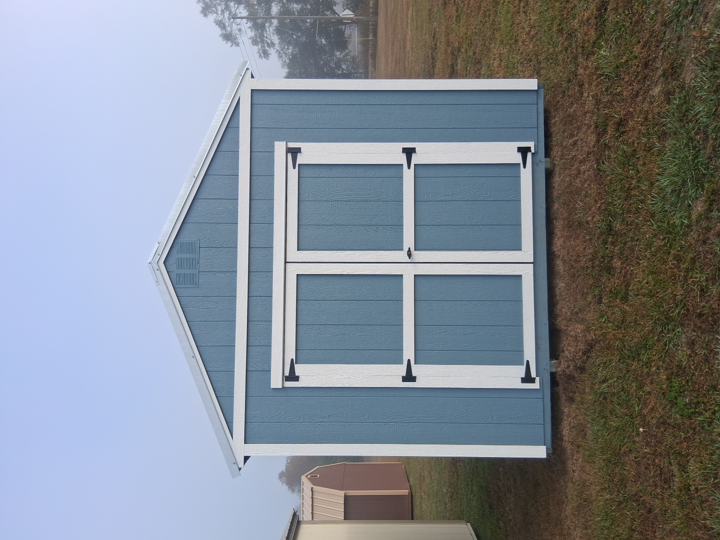 Blue portable shed with double doors